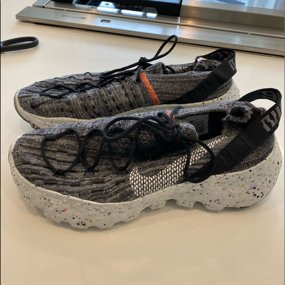 Nike Women's Gray Knit Athletic Sneakers with Black and Orange Accents